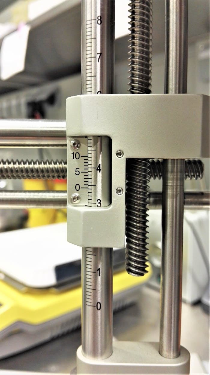 Close-up of precision measuring equipment with scale in a workshop setting.